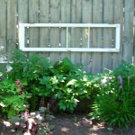 window panes decorate fence Lockport in Bloom garden walk