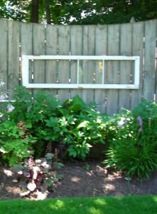 window panes decorate fence Lockport in Bloom garden walk