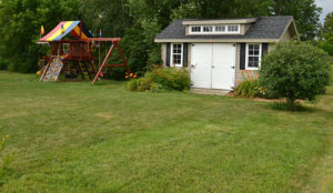 play area and shed at the back of the yard