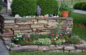 wall with garden and statues in Lockport