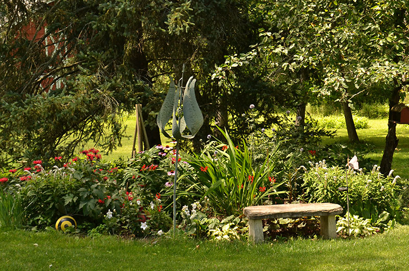 stone bench by garden