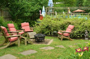 chairs in yard with gardens