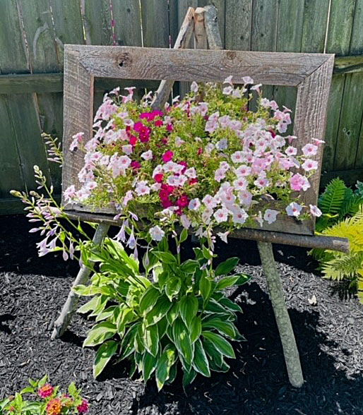 flowers on easel during Snyder-CleveHill Garden Walk in Amherst and Cheektowaga NY