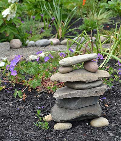 small stones stacked in garden in South Buffalo