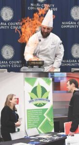 cannabis conference in Niagara Falls NY: chef using cannabis and vendor at table